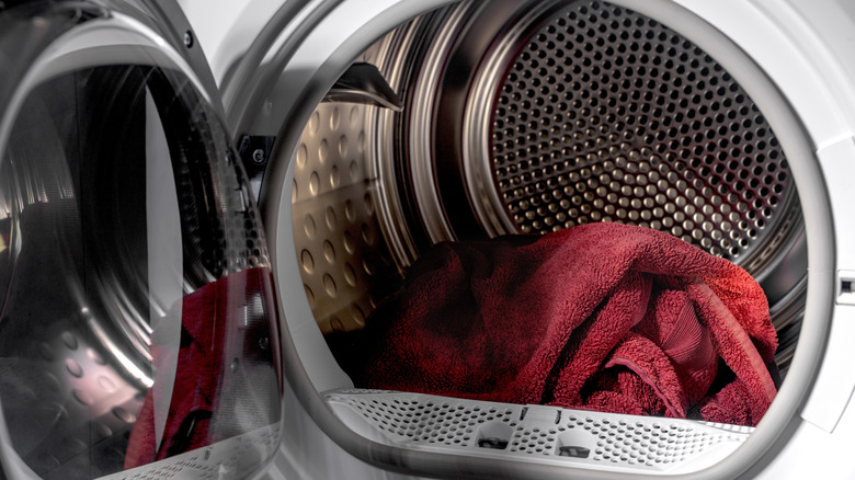 Towels sitting inside of a clothes dryer