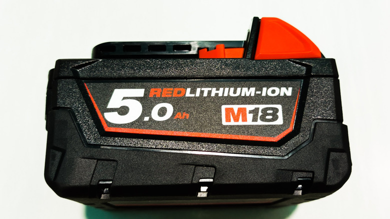 Milwaukee M18 battery on white background