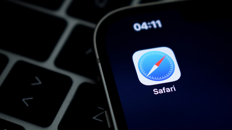 iPhone on keyboard showing Safari icon