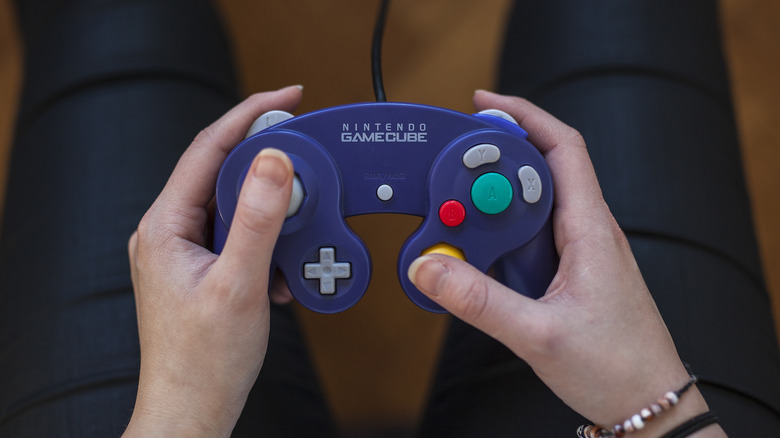 hands holding GameCube controller