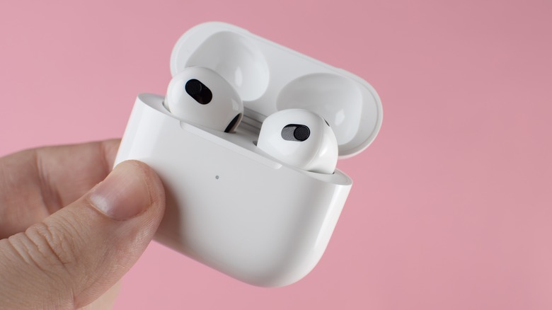 AirPods Pro in charging case on pink background
