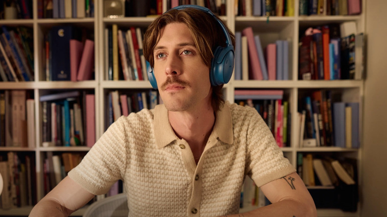 Person wearing Bose headphones