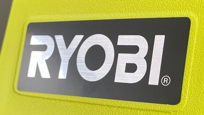 The Ryobi logo on a tool.