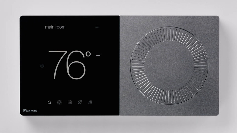 A close-up of a Daikin smart thermostat with a built-in dial
