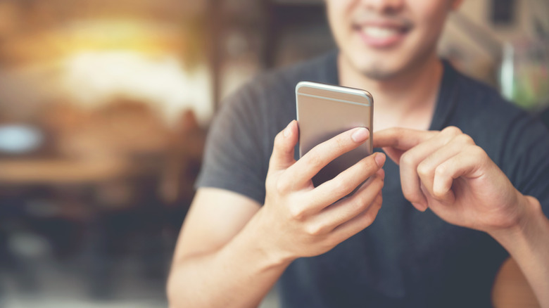 man using iphone