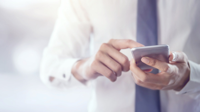 man using iphone