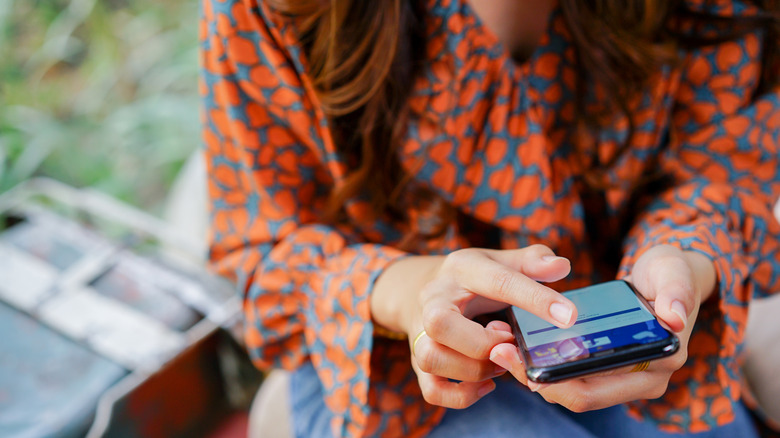 woman using iphone