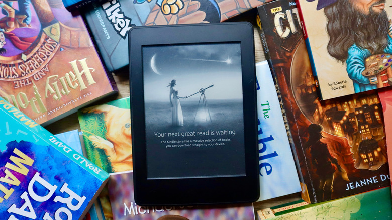 Kindle on top of books