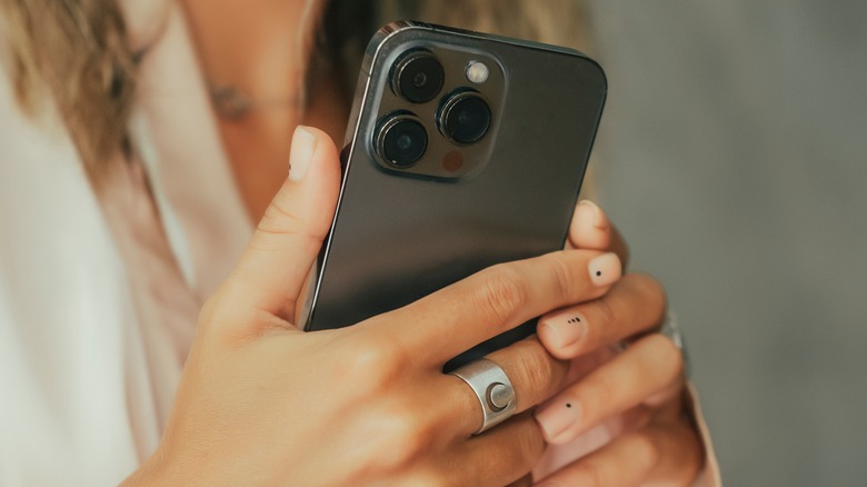 woman holding an iPhone