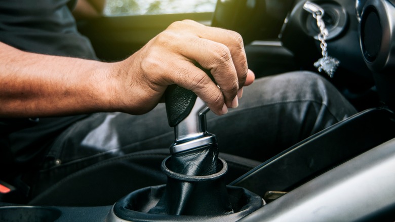 hand on gear shifter