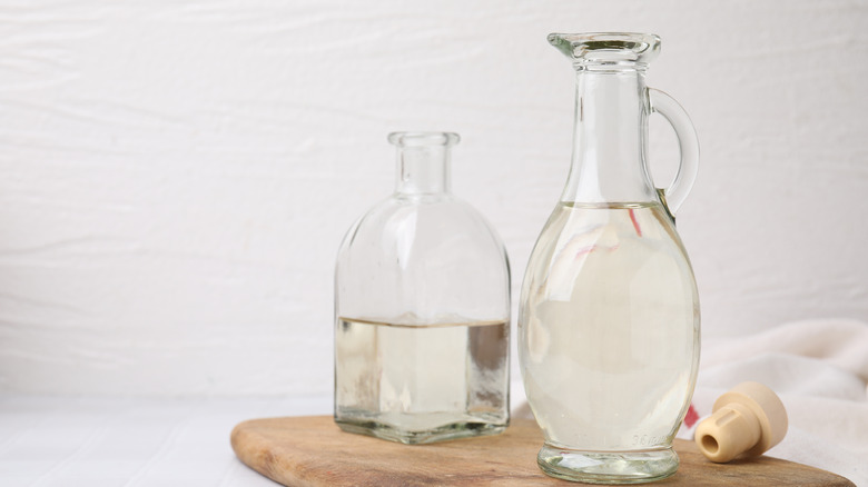 Jugs of white vinegar on a table