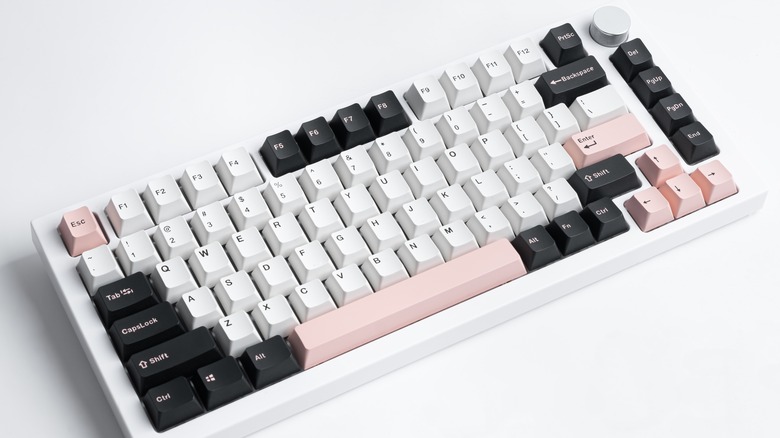 keyboard with black, white, and pink keys