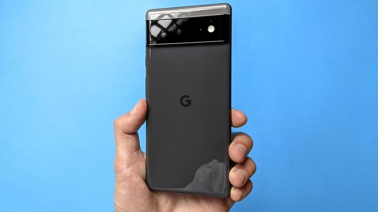 man holding google pixel 6