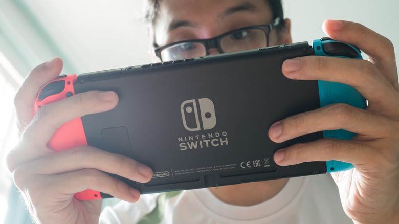Man playing Nintendo Switch