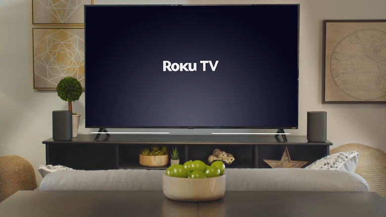 Roku TV in living room with Roku speakers on both sides