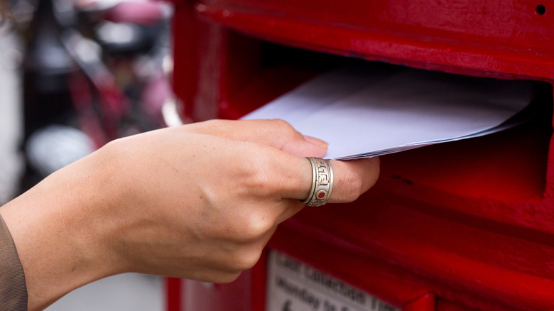 Someone mailing a letter
