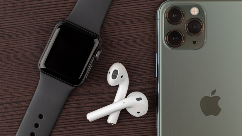 Apple Watch next to AirPods and iPhone