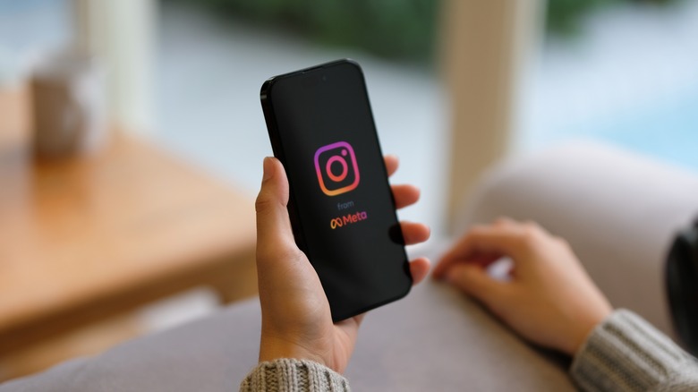 person looking at Instagram app on phone