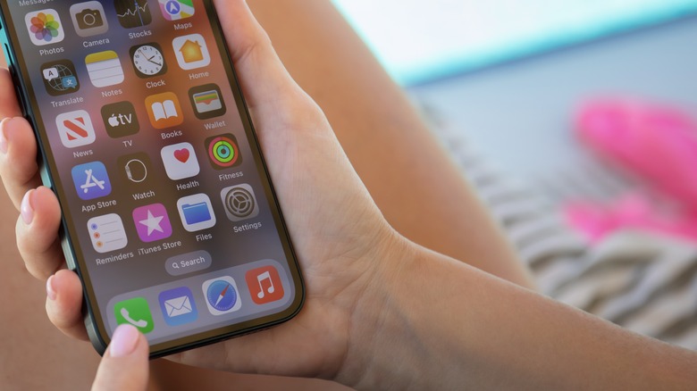 woman tapping iphone phone app