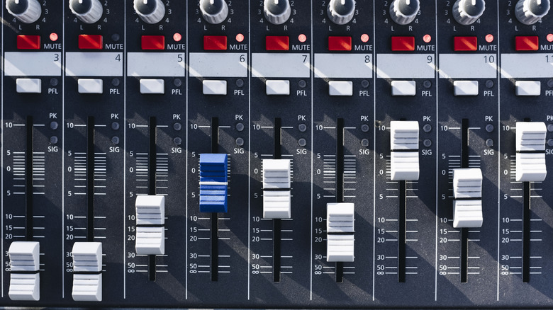 Faders on a mixing board