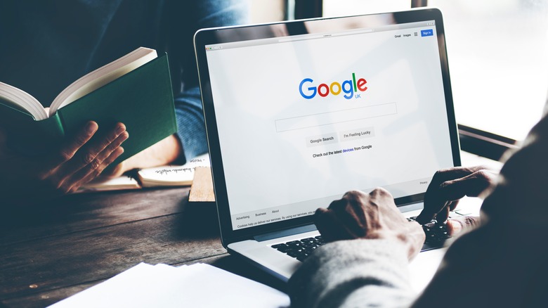 Person at desk searching Google UK