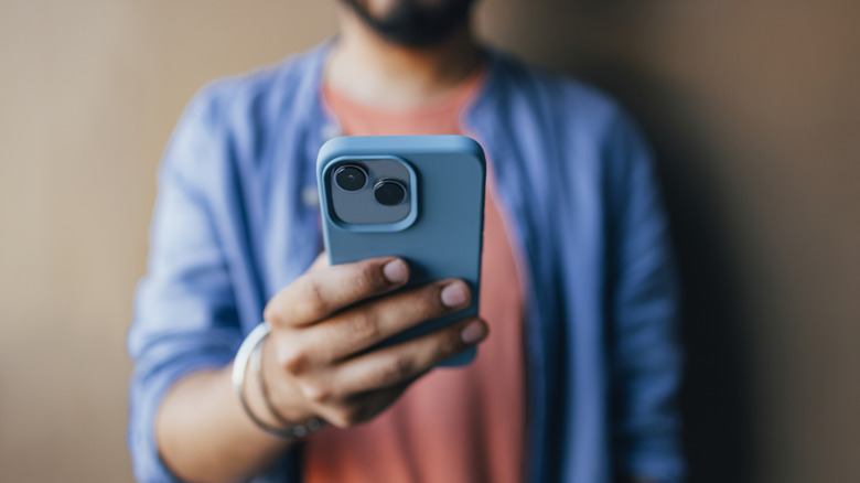 Man looking at an iPhone