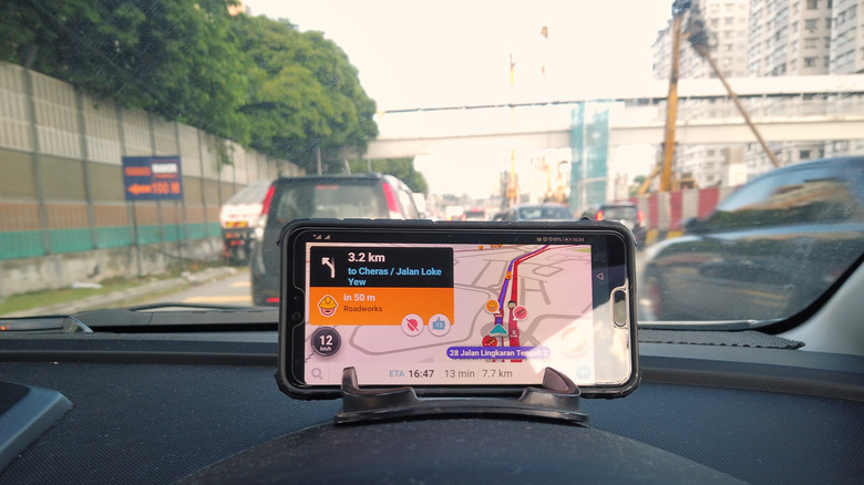 Waze app showing navigation and speedometer