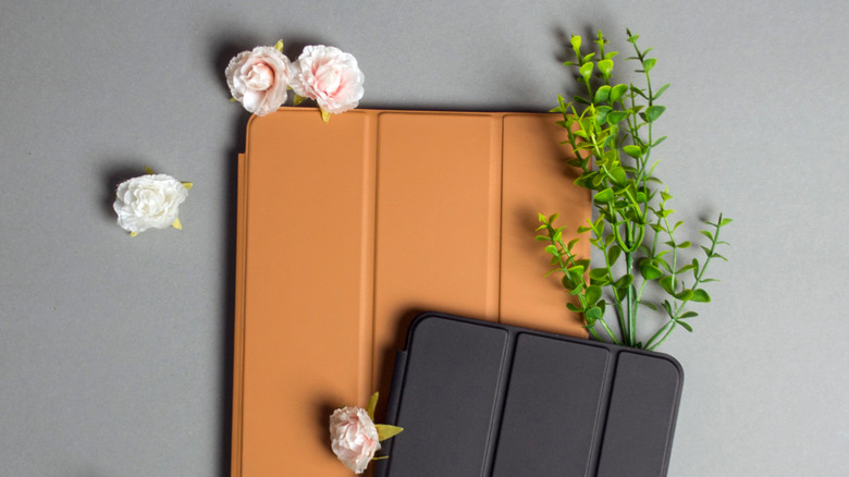 black and brown iPad cases on table