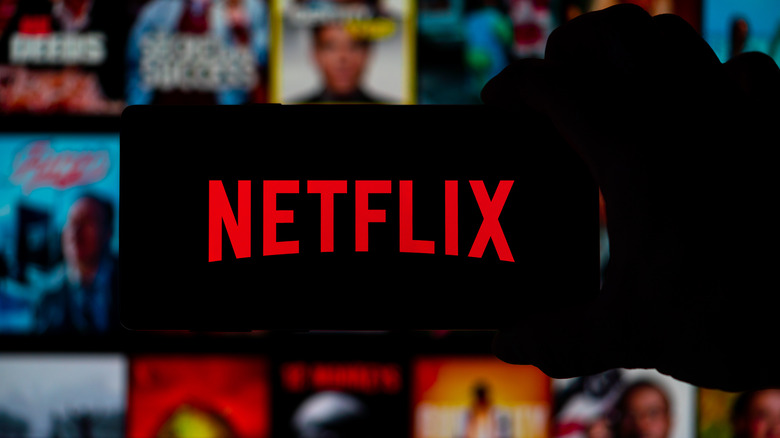 Netflix mascot on smartphone's silhouette