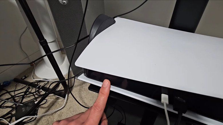 Man turning on PS5