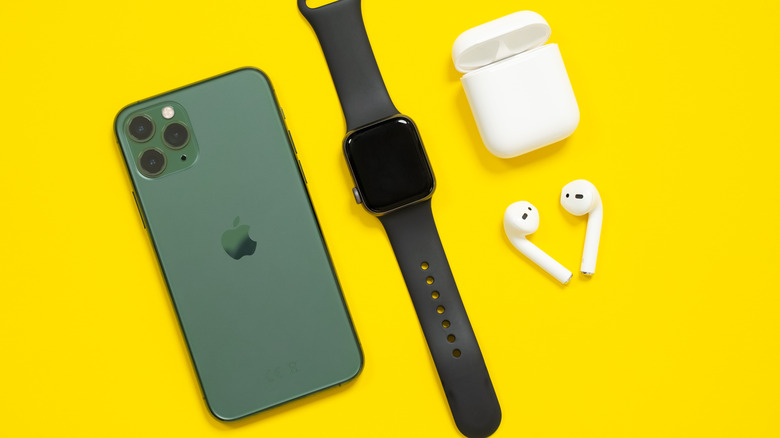 iPhone with Apple Watch and AirPods