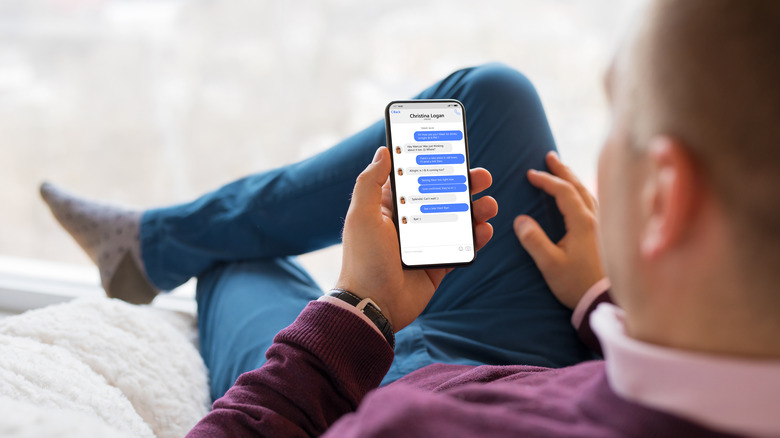Man texting on iPhone