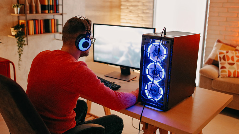 A person playing a video game on a gaming PC