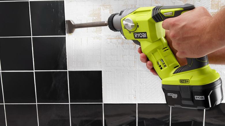 person using ryobi rotary hammer