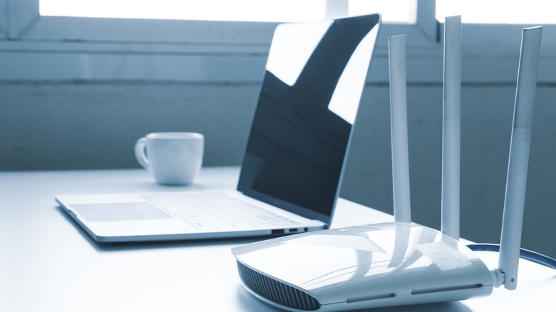 computer and router device on a table