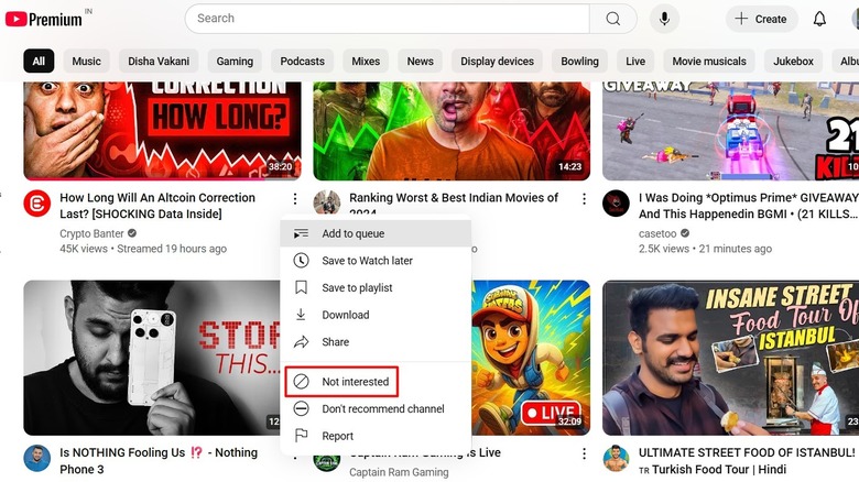 YouTube page with the 'Not Interested' option highlighted