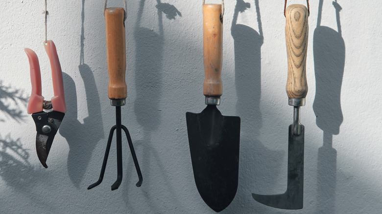 Wooden garden tools hanging