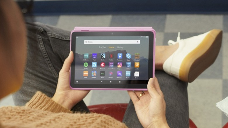 adult woman using amazon kindle fire