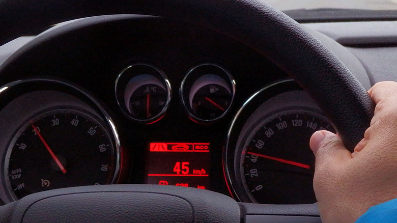 close up view of a car speedometer while driving
