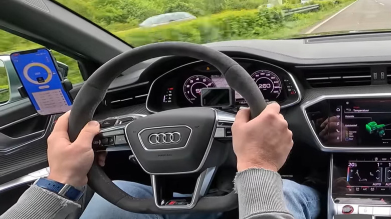close up view of an Audi RS6 C8 dash panel driving on the Autobahn