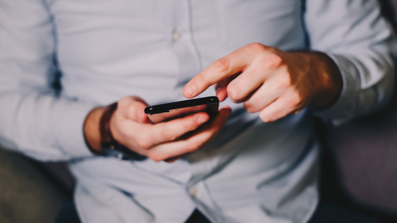 man using an Android phone