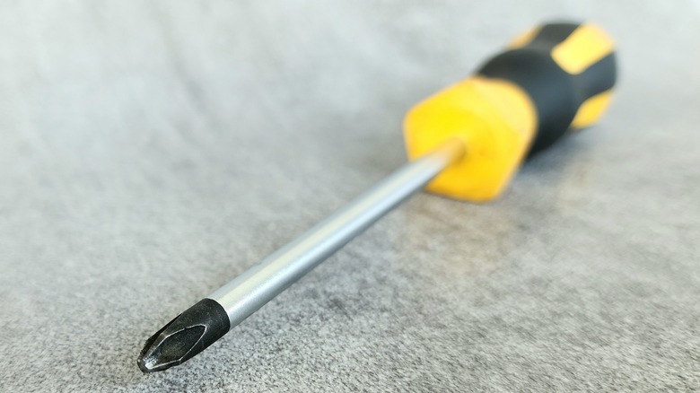 Screwdriver laying on a mat for display