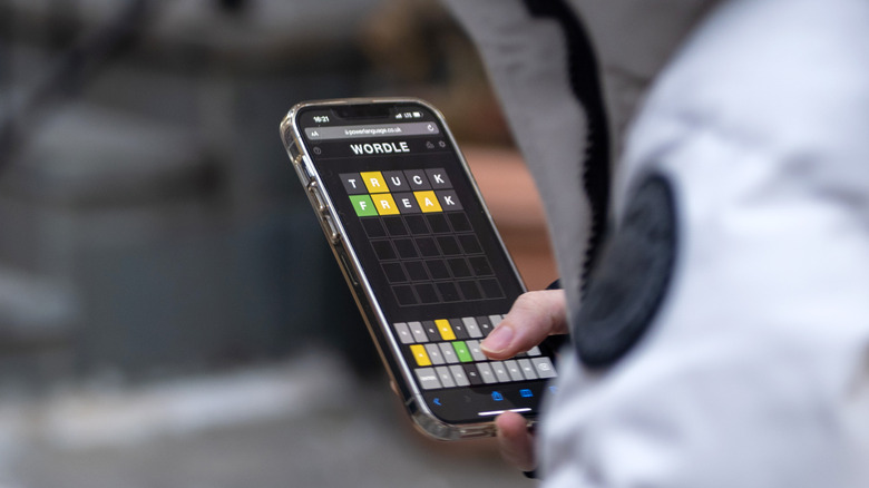 Closeup of playing Wordle on a smartphone