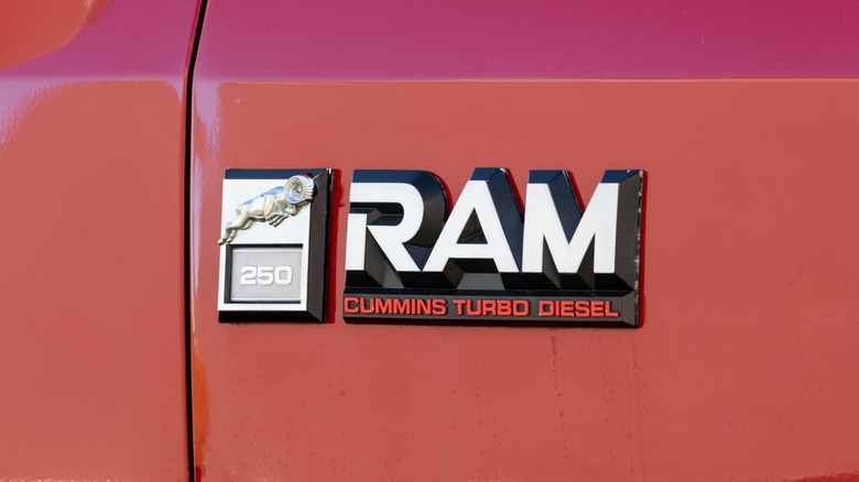 A Ram Cummins turbo diesel placard on an older Dodge Ram pickup truck