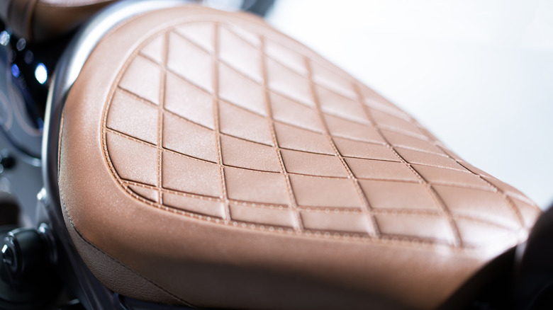 Close up of a custom motorcycle seat with a diamond-stitch pattern