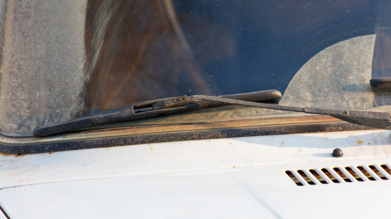 Rusted wiper blade resting on windshield