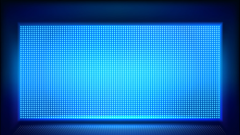 A tv showing blue dots on blue background