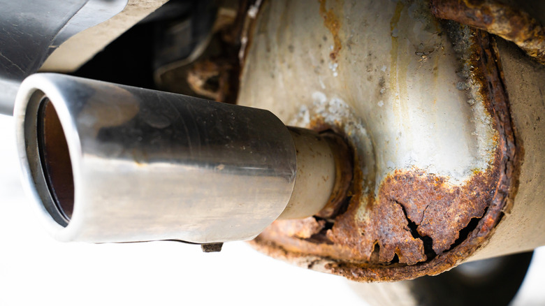 A rusty muffler with lots of corrosion