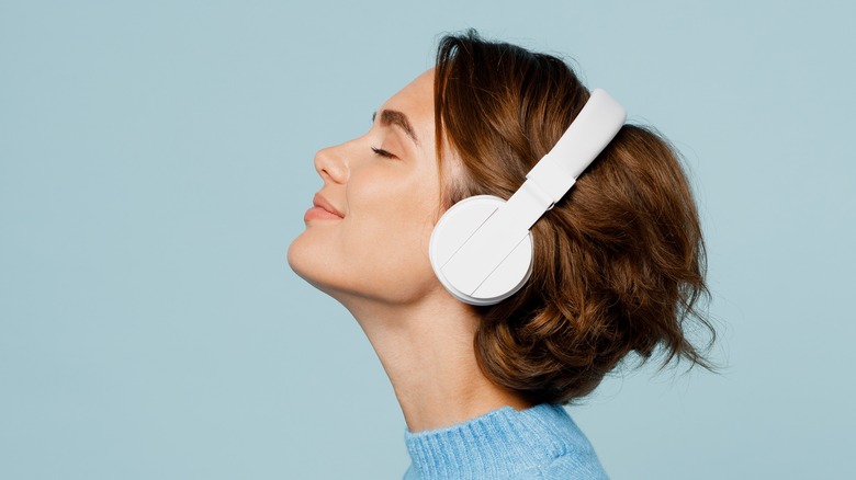 smiling woman wearing headphones