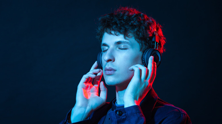 Man listening to Bluetooth headphones